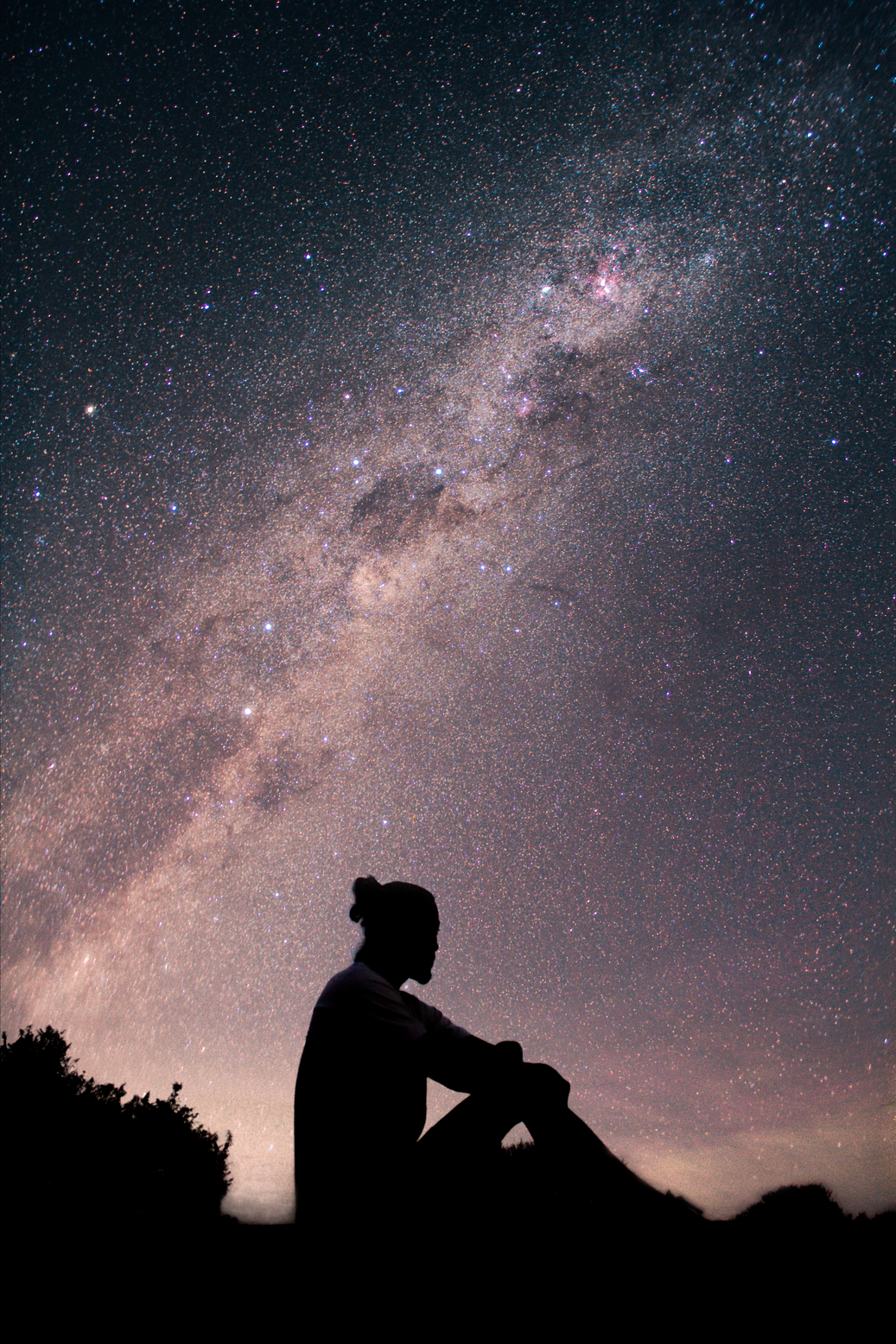 Silhouette of Man Standing Under Starry Night